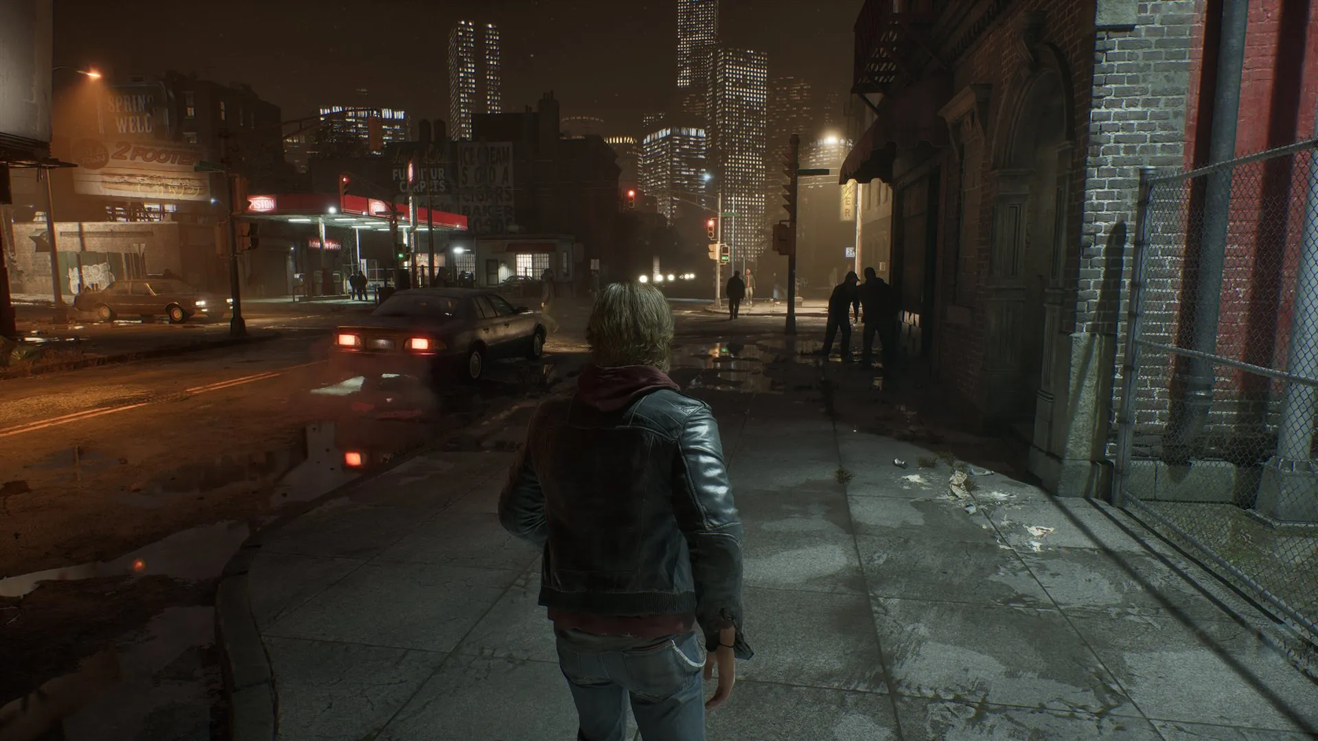 Samson walking along a city street at night with pedestrians nearby.