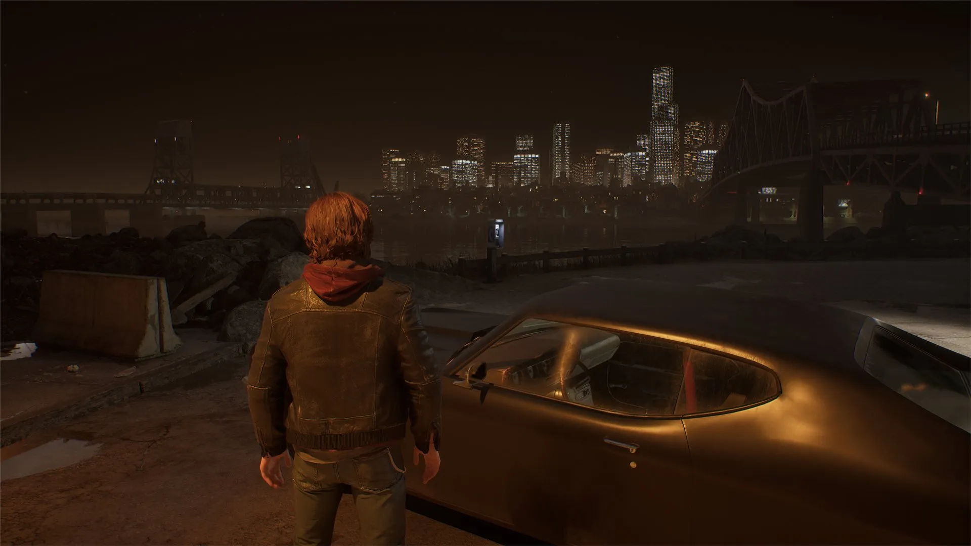 Samson looking across the city skyline at night beside a car.